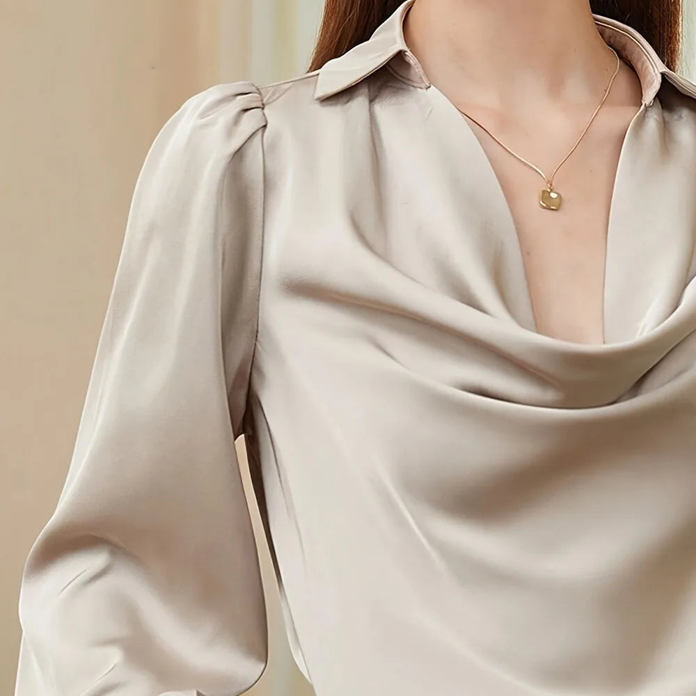 Blusa caída dobras gola V